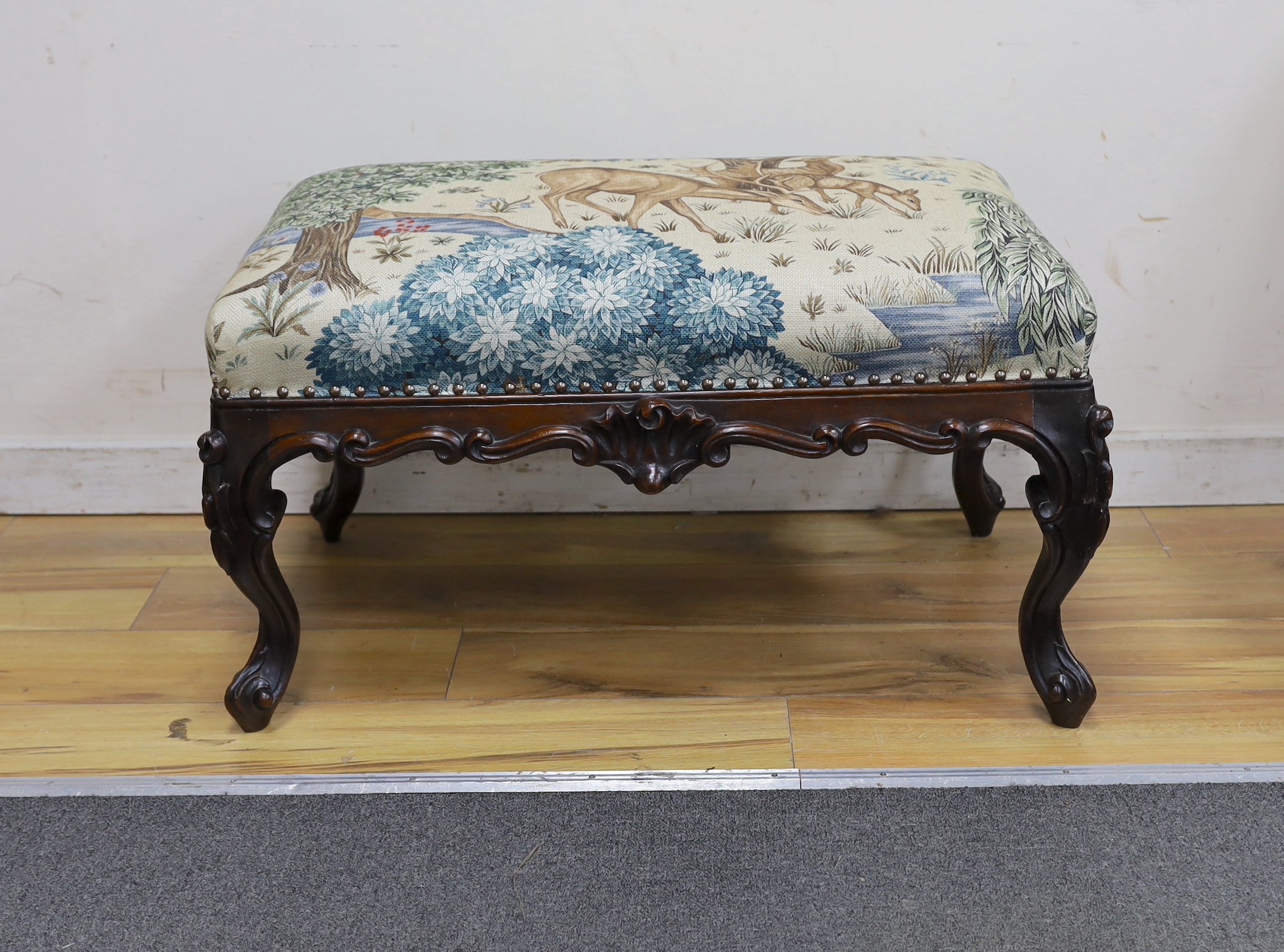 A Victorian carved mahogany dressing stool, re-upholstered in a William Morris-designed fabric, The Brook Tapestry, width 80cm, depth 50cm, height 44cm